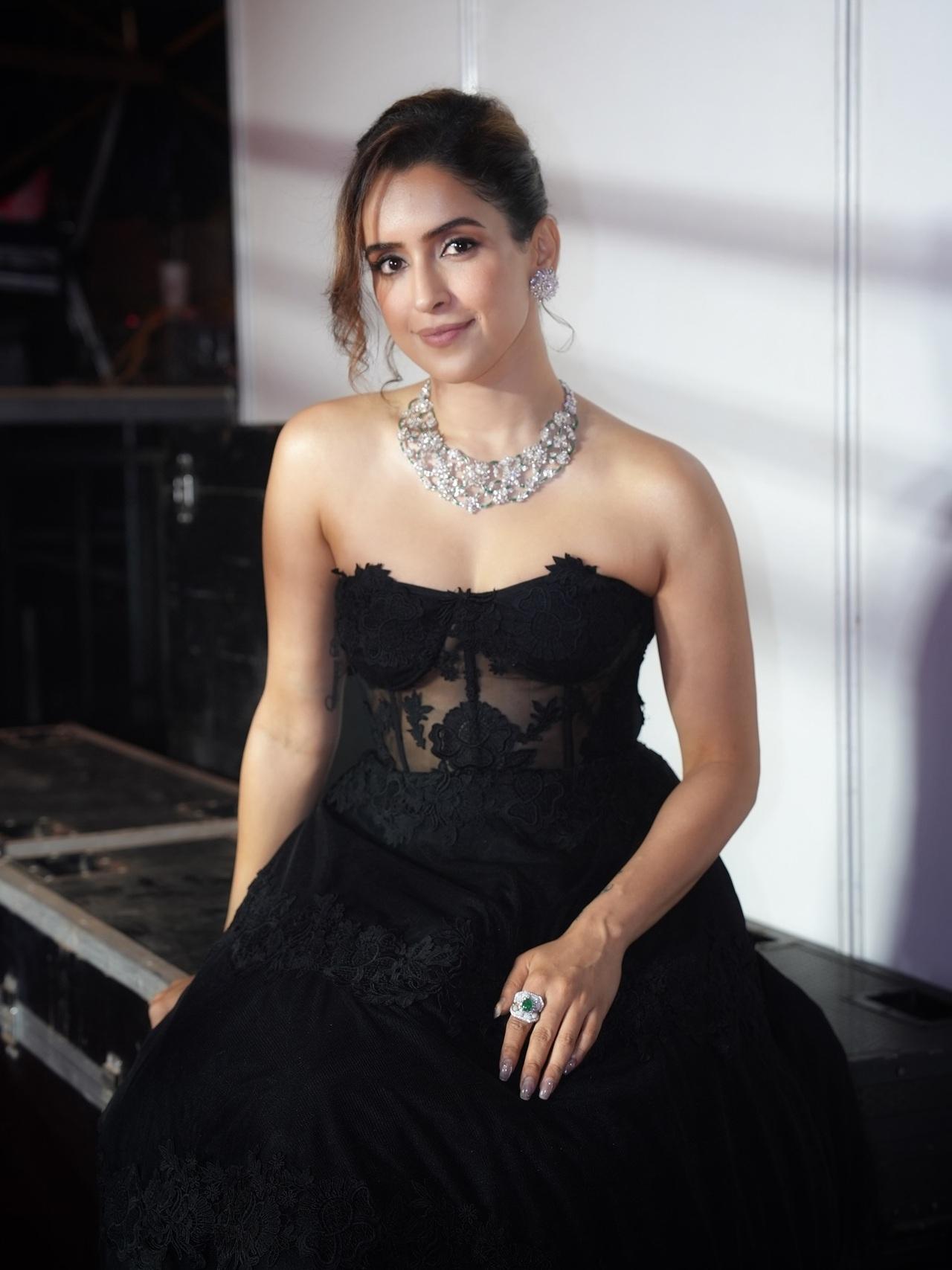 Sanya Malhotra turned heads in a black strapless gown adorned with intricate lace detailing that added texture and drama to the look. She elevated the ensemble with a heavy diamond necklace.